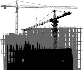 large black and grey two cranes above unfinished buildings