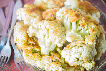 Fried cauliflower closeup on the plate on a table