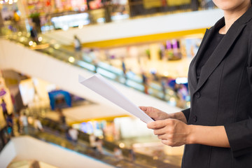 Businesswoman reading a business document.