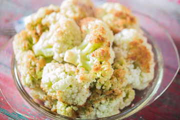 Fried cauliflower closeup on the plate on a table