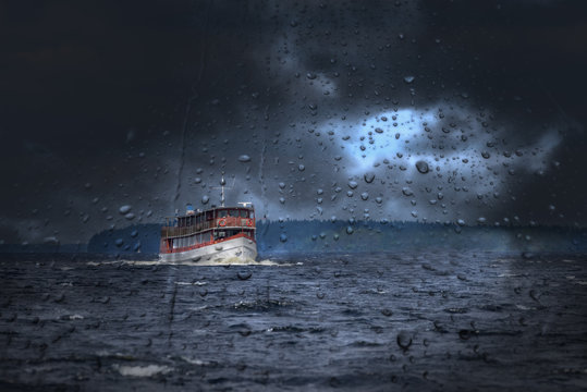 Old cruise ship in storm on the lake