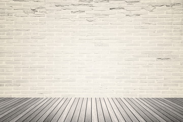 Old interior room with brick wall and wood floor