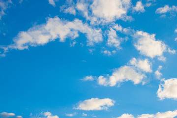 blue sky background with tiny clouds