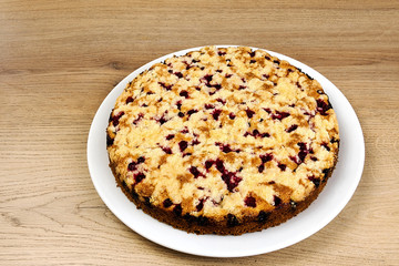 Currant cake on table