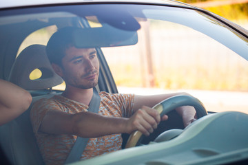 Naklejka premium Happy couple in the car