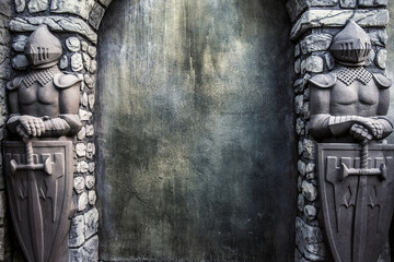 Knight Protectors Stone Statues and Cracked Grunge Wall Background - 87085380