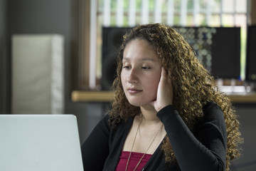 A young woman working on her computer