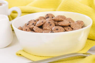 Cookie Crisp - Chocolate chips cookies cereals in yellow bowl.
