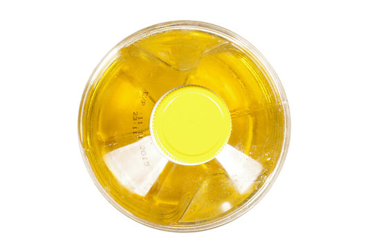 Abstract photography top view of closed plastic sunflower oil bottle isolated