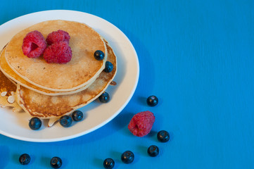 Stack of wheat golden pancakes or pancake cake with freshly