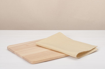Natural Cotton Napkin And Wooden Board On White Painted Wood Bac