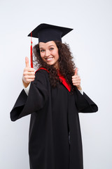 Studio portrait picture from a young graduation woman