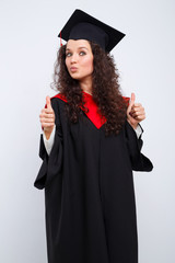 Studio portrait picture from a young graduation woman