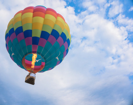 fire heating up air as hot air balloon rises in the air