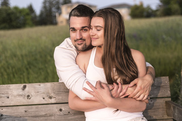 Young couple in love outdoor at the sunset