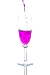 purple cocktail in glass on white background