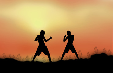 Silhouette man fight Sunset background