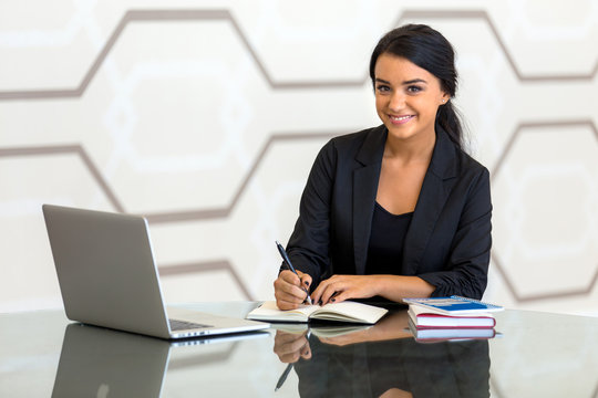 Office consultant executive woman business finance in suit smiling while working