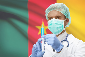 Doctor with syringe in hands and flag on background series - Cameroon