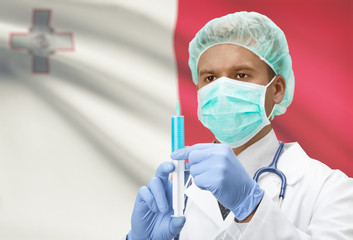 Fototapeta premium Doctor with syringe in hands and flag on background series - Malta