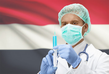 Doctor with syringe in hands and flag on background series - Yemen