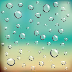 Water drops against blurred beach - background for text