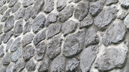 beautiful wall of gray round stones