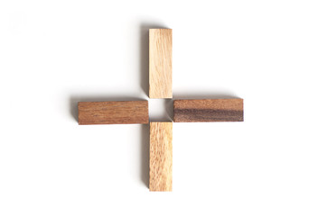 Wood block as plus sign