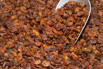 Basket of sun raisins at an open air food market bazaar.