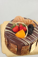 Chocolate strawberry cake on white background.