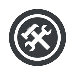 Round black repairs sign