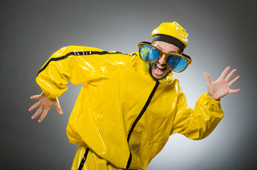 Man wearing yellow suit in funny concept