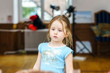 Cute little girl close-up indoor portrait