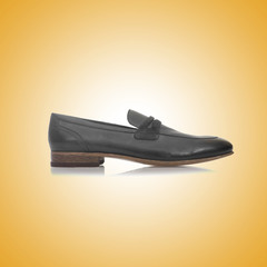 Fashion concept with male shoes against gradient 
