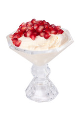 Pomegranate Topping on Ice Cream – Pomegranate seeds on a bowl of vanilla ice cream.