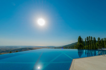 Infinity pool on the bright summer day