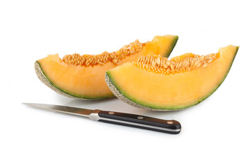 Cantaloupe melon slices with kitchen knife