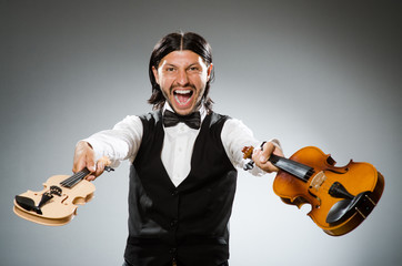 Man playing violin in musical concept © Elnur