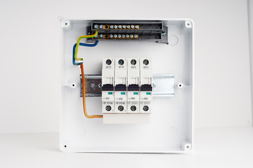 Electrical cabinet with four automatic fuses with wires. Ready for installing. Electricity distribution box. Fusebox. 