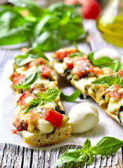 Pizza with eggplants on a french baguette.