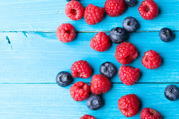 Summer berries on wooden background