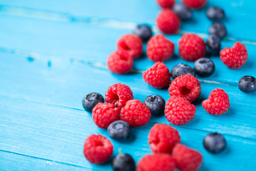 Summer berries on wooden background
