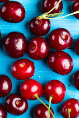 Cherries on a blue wooden background