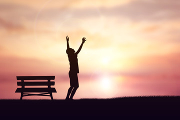 Human hand side above the background sky orange.