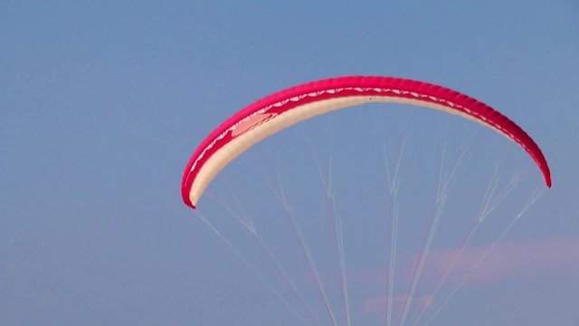 paraglider landing on beach