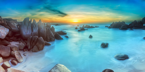 Naklejka premium Ke Ga sea sunrise, Binh Thuan with rock structures leads into the sun rises, the sea make the beach more impressive when welcoming a new day