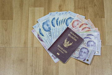 Thailand passport with Singapore dollars