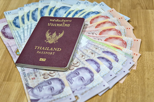 Thailand passport with Singapore dollars