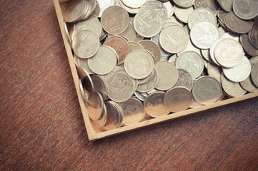 coins on wood with filter effect retro vintage style