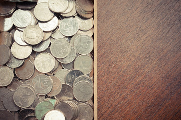 coins on wood with filter effect retro vintage style